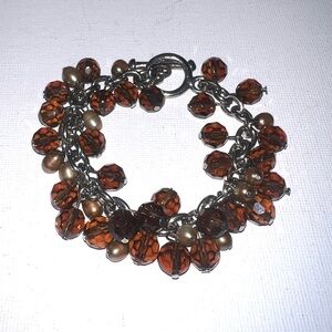 ♦️
Elegant Beaded Bracelet with Brown and Gold Accents